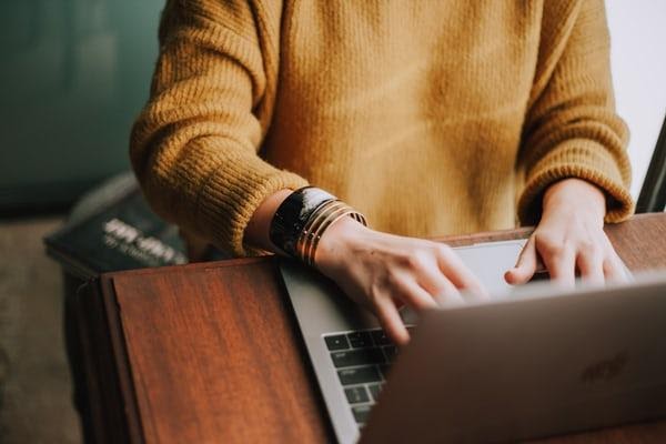 Person typing on a laptop.