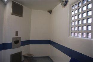 Police station cell with toilet.